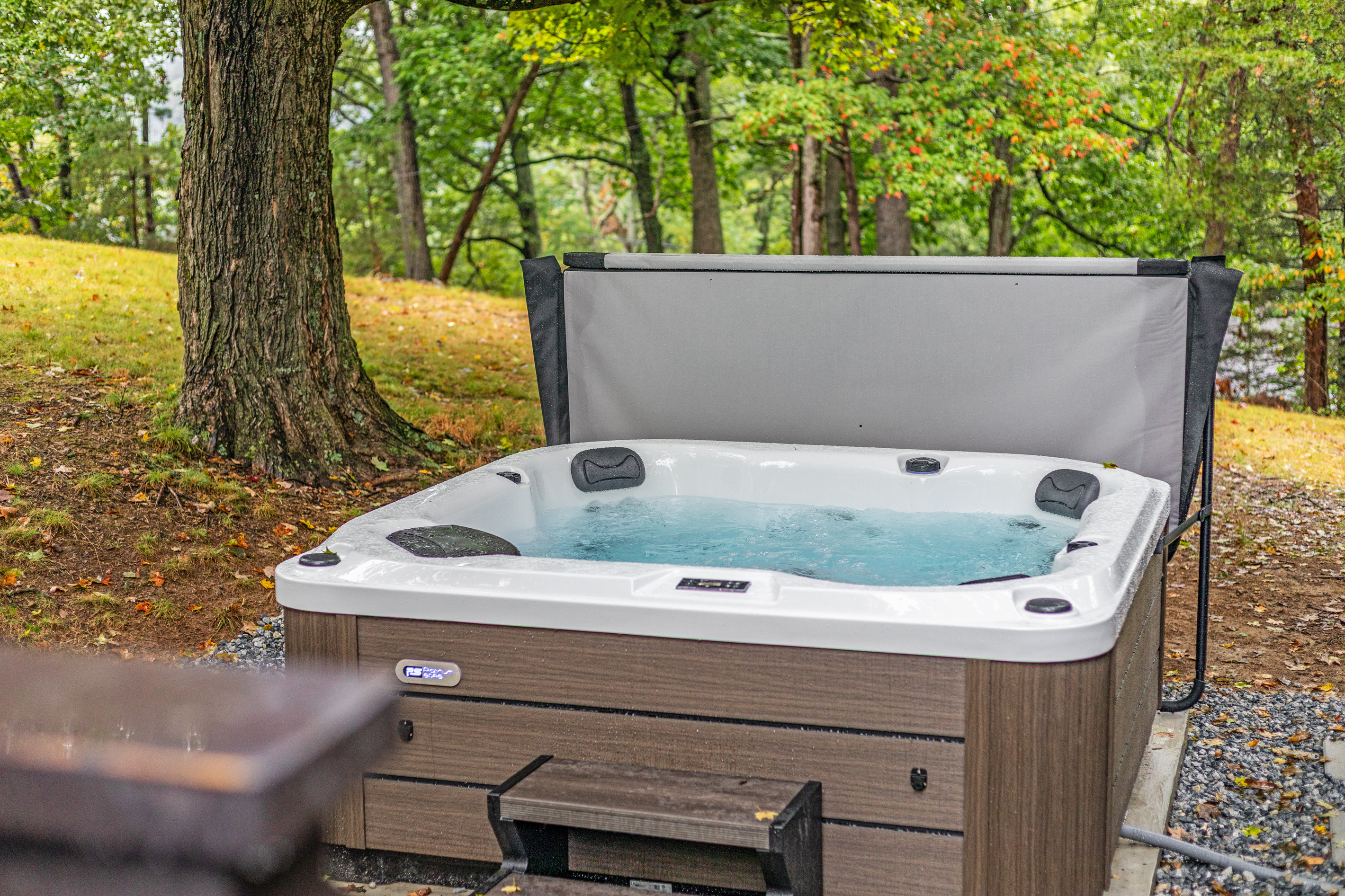 Nestled beneath a canopy of trees, the private hot tub is the ultimate spot to soak away the day. Whether you're unwinding after a hike, stargazing after dark, or just enjoying the quiet of the woods, this is where relaxation meets nature.