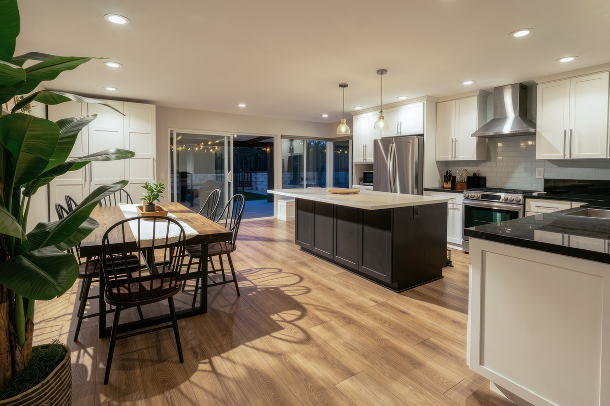 Large open concept kitchen dining and living area goes right into the backyard