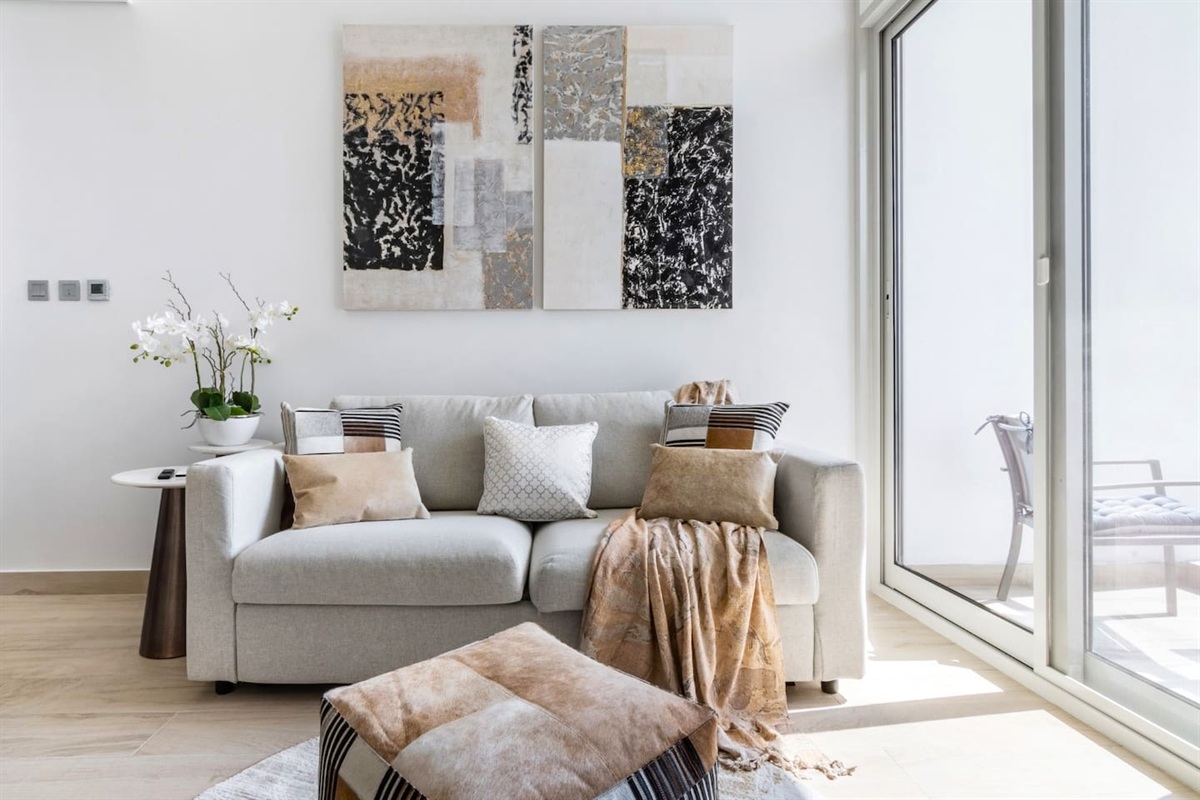 Cozy up in our sunlit living room.