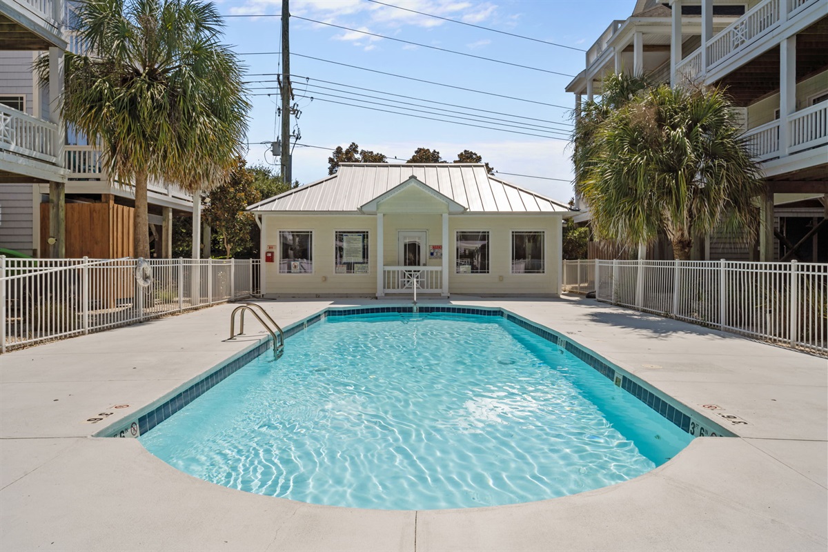 Community pool located right behind the house
