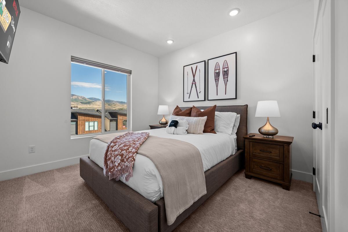A comfortable bedroom with warm décor and a calm atmosphere for restful nights.