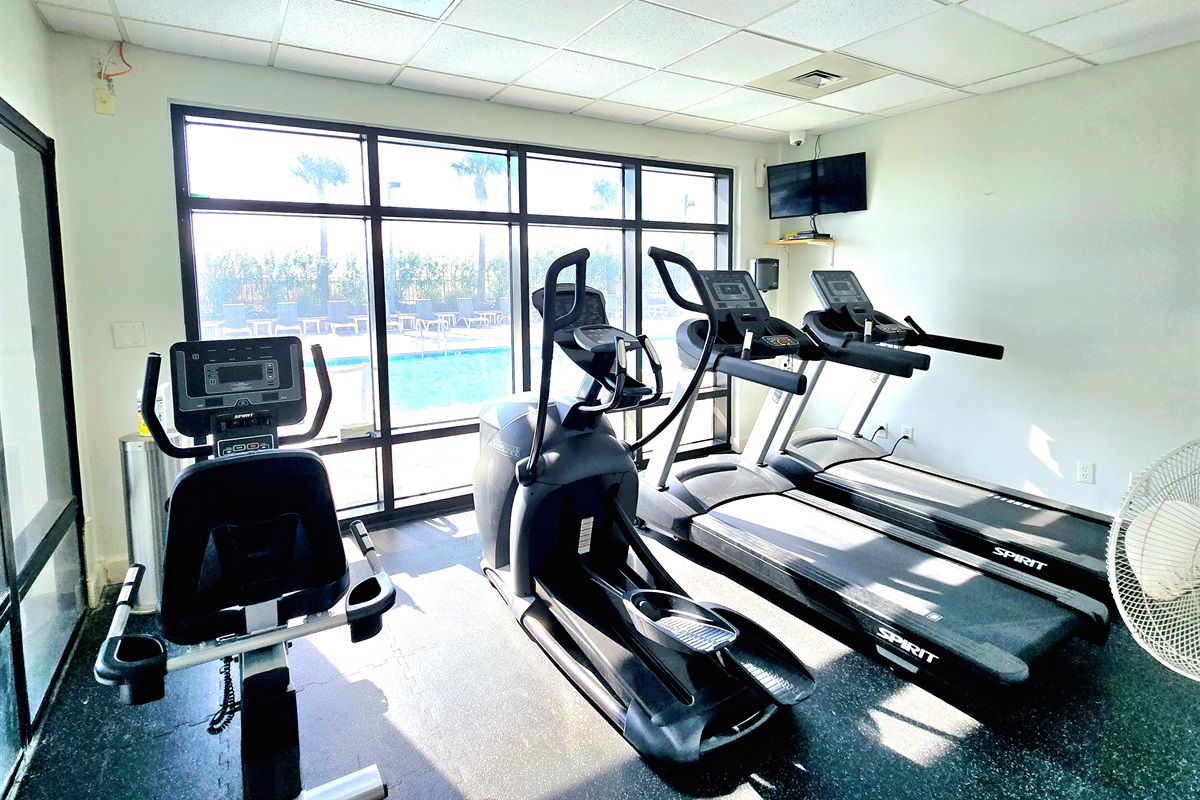 fitness room overlooking the pool