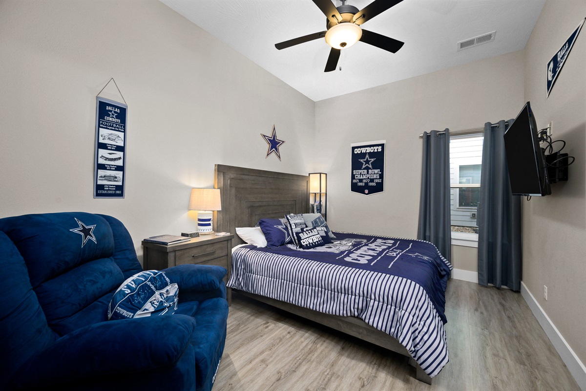 Lower level: Cowboys room with king bed, recliner, and en suite bathroom