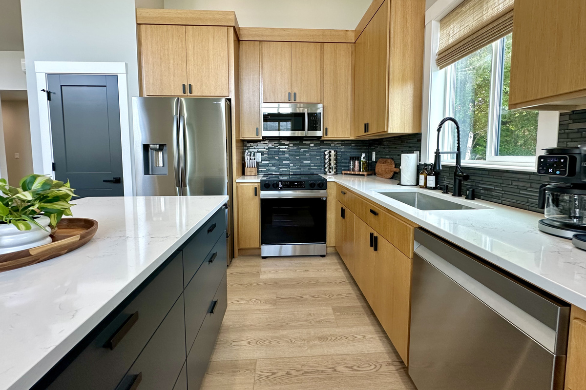 The kitchen is fully stocked: quartz counters and full-size stainless appliances. Bring your clothes and your groceries; we have the rest.