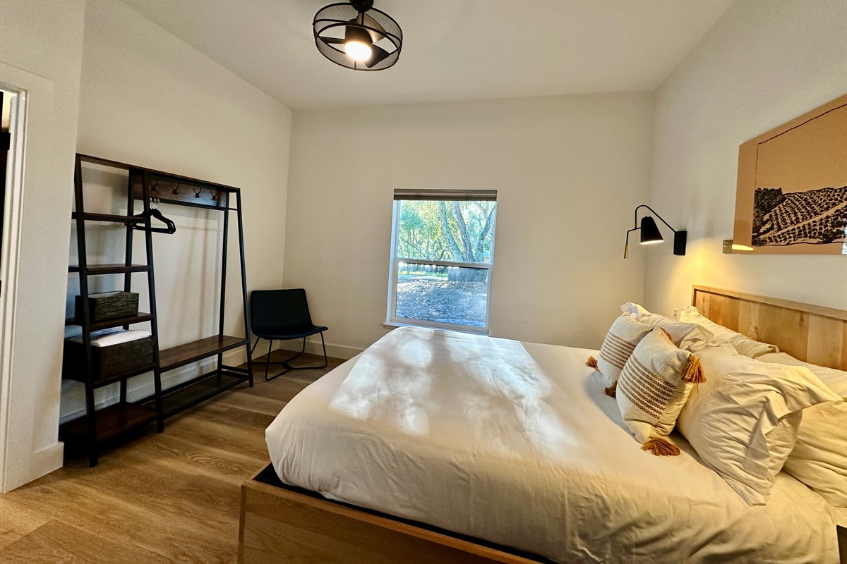 A calming queen sanctuary layered in soft tones and boutique-inspired details.