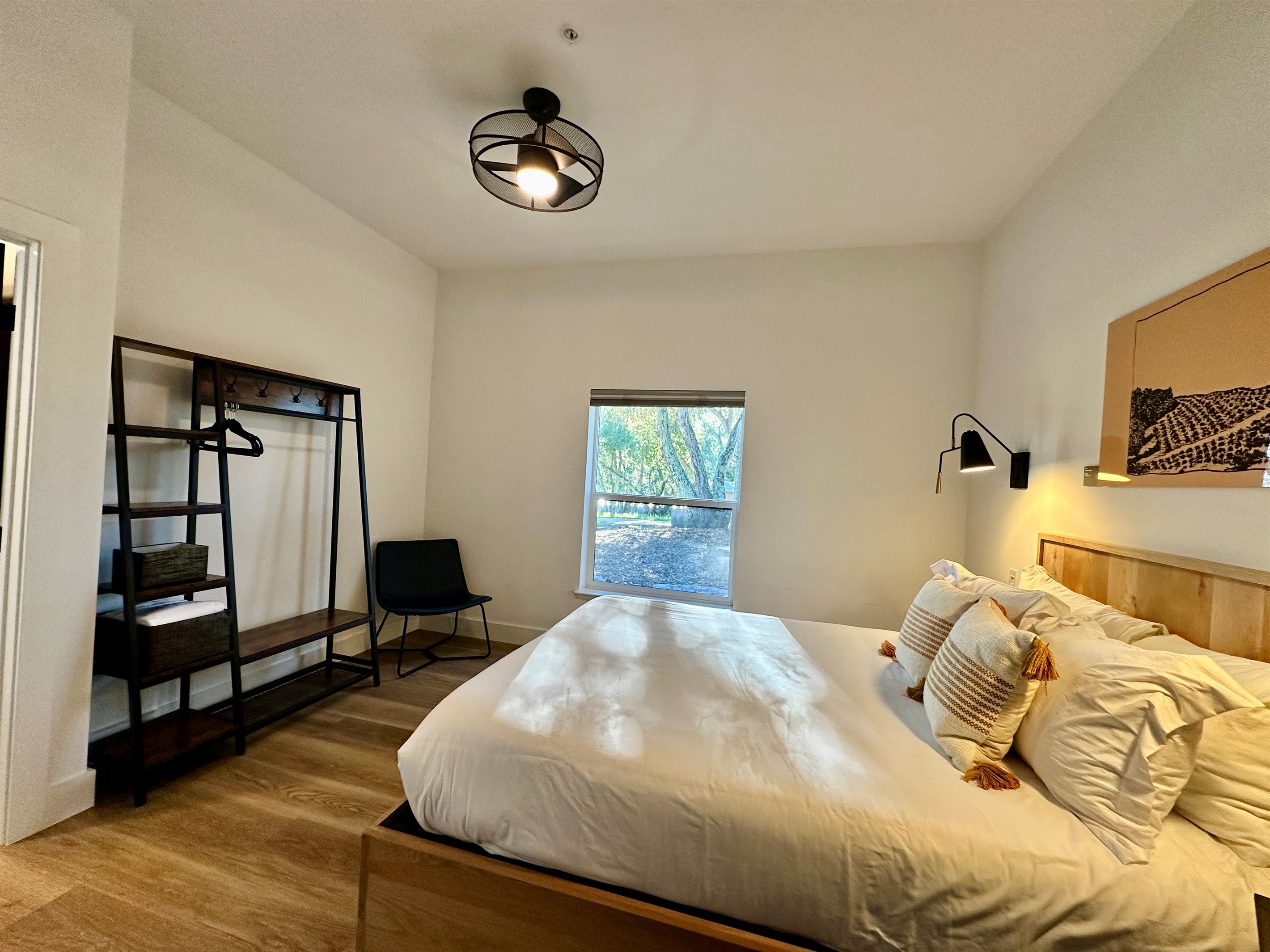 A calming queen sanctuary layered in soft tones and boutique-inspired details.