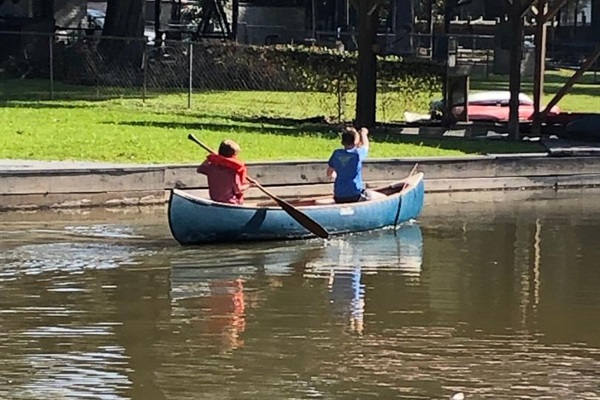 Kids canoeing on the lake.