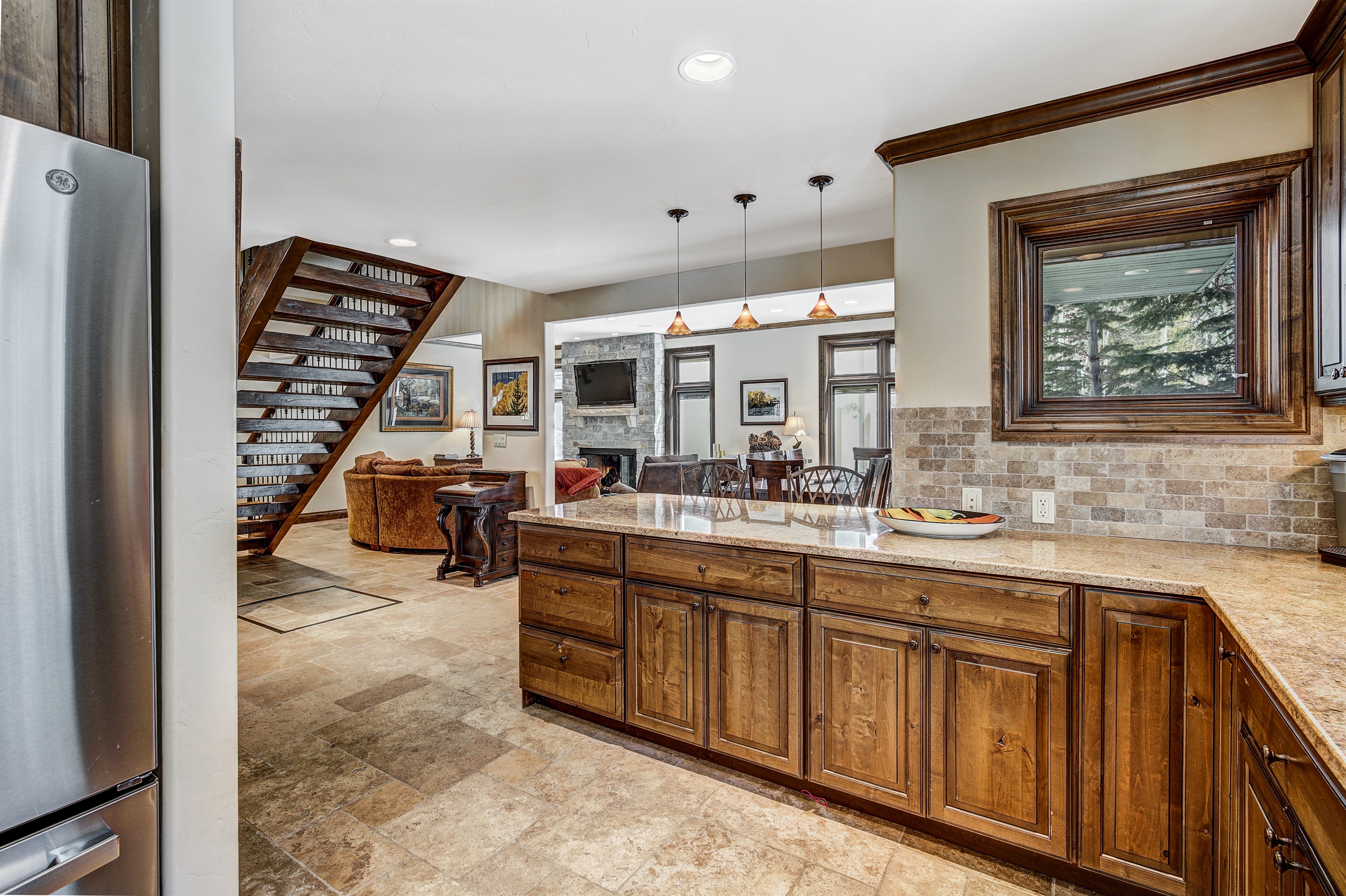 Kitchen with open floor plan to dining and living areas.