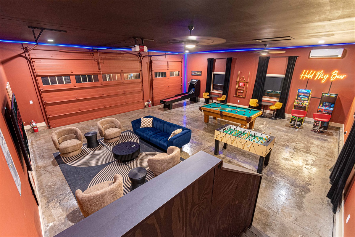 Massive 800 square feet game room that is heated and cooled with 83 inch big screen, pool table and more!