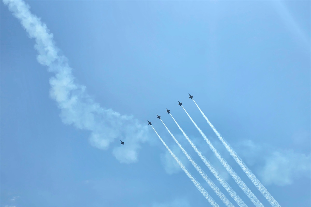 Check out the home of the Blue Angels.  On occasion you'll see them fly over the beach.  Check out the Blue Angels website for schedules.  The biggest show is mid July!