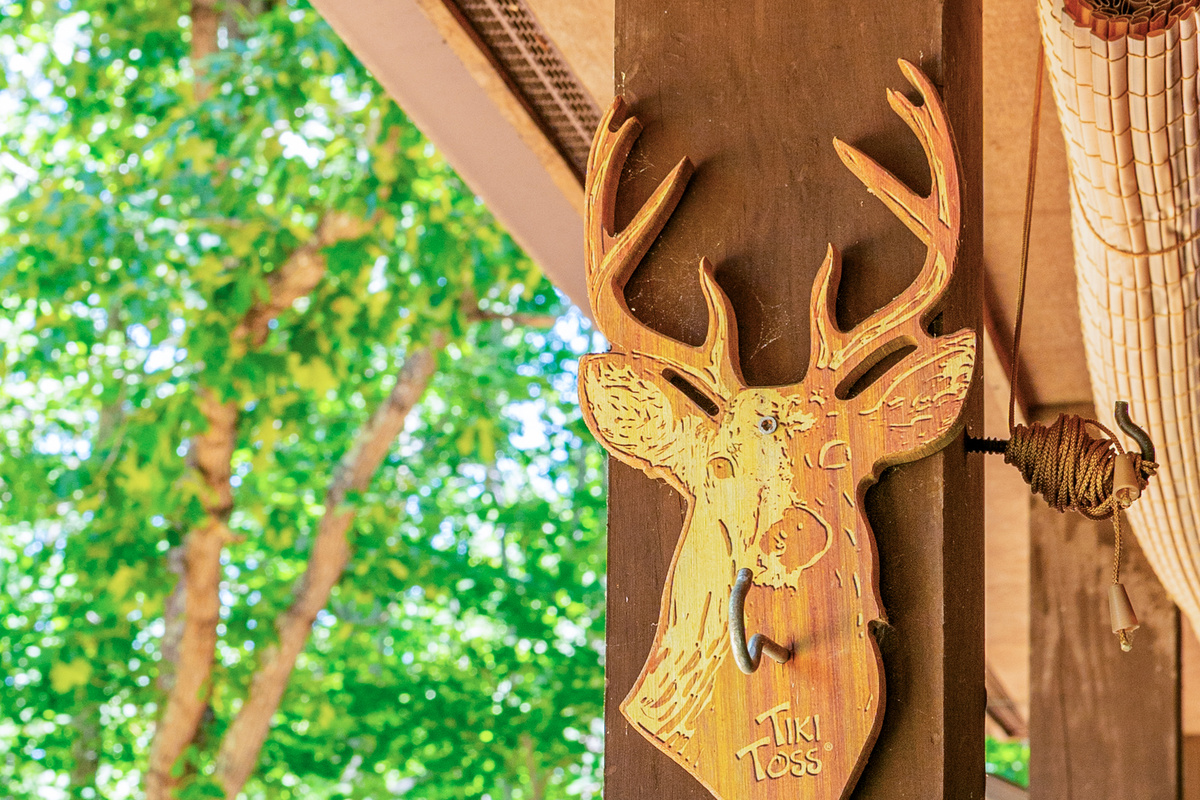 Tiki Toss Fun: Challenge friends to a game while surrounded by nature's vibrant beauty!