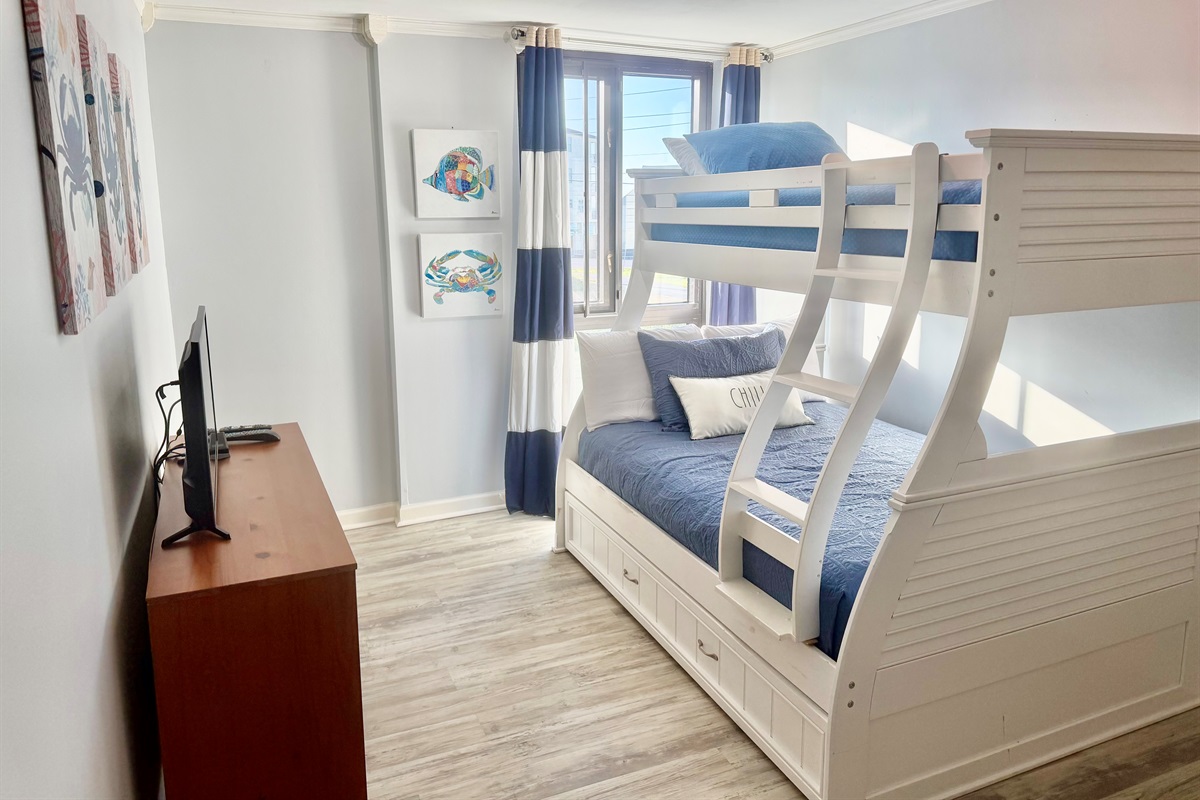 The guest bedroom has bunks with a twin on top, full on botton, and a twin trundle bed.