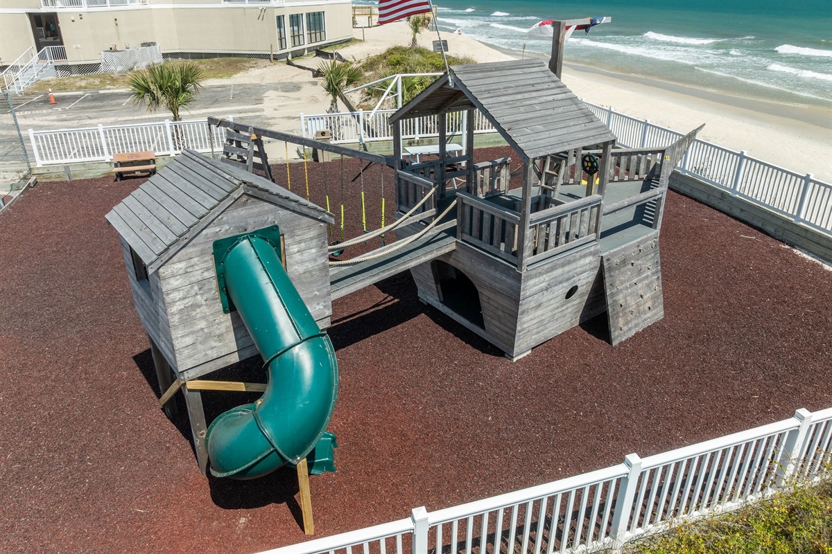 Family-friendly amenities including playground by the ocean