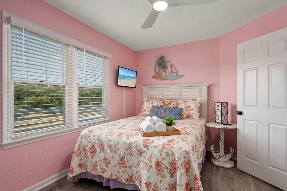 Beautifully decorated bedroom with vibrant colors and a cozy atmosphere.