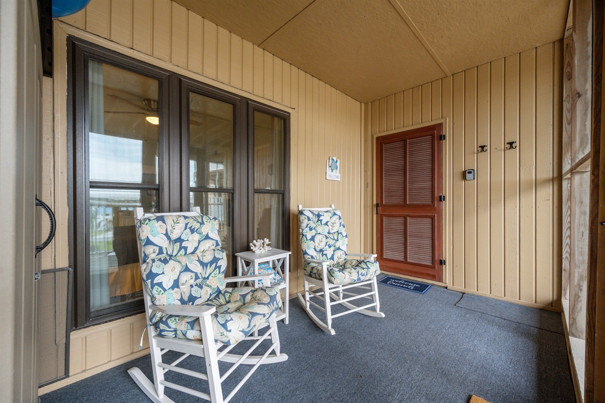 Comfortable rocking chairs in the screened-in porch