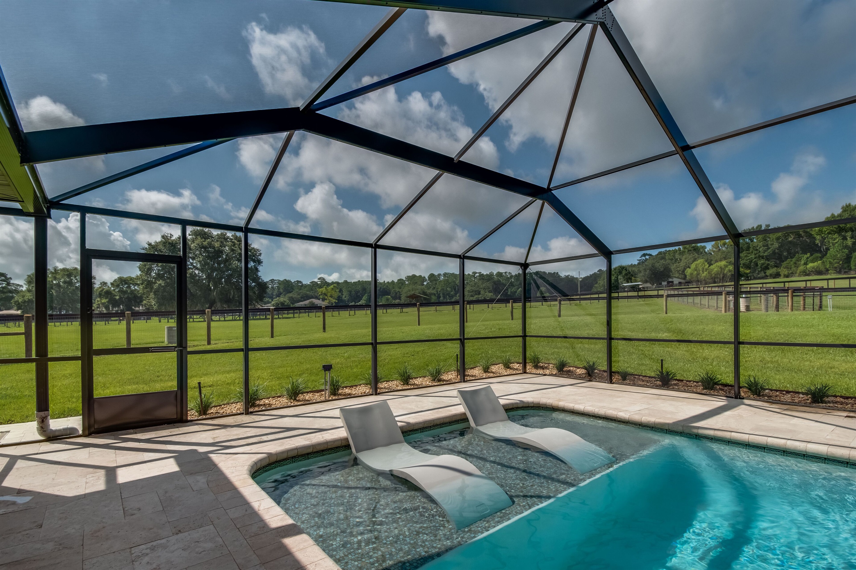 Gorgeous screened pool with sun shelf