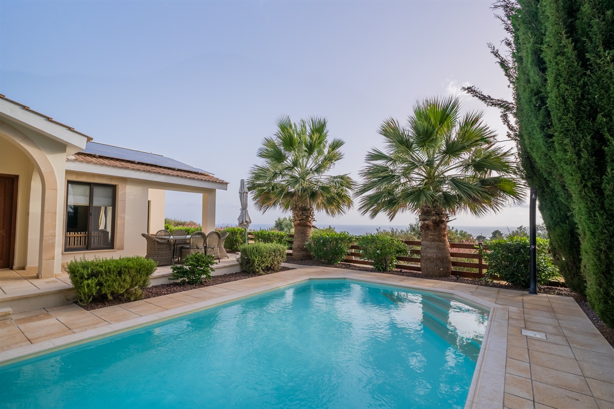 Enjoy a refreshing dip in the large swimming pool, newly refinished with easy-access staircase and extra-high skimmers. Solar-heated shower for rinsing off. Pool heating is available during the cooler months for an added fee, ensuring year-round comfort.