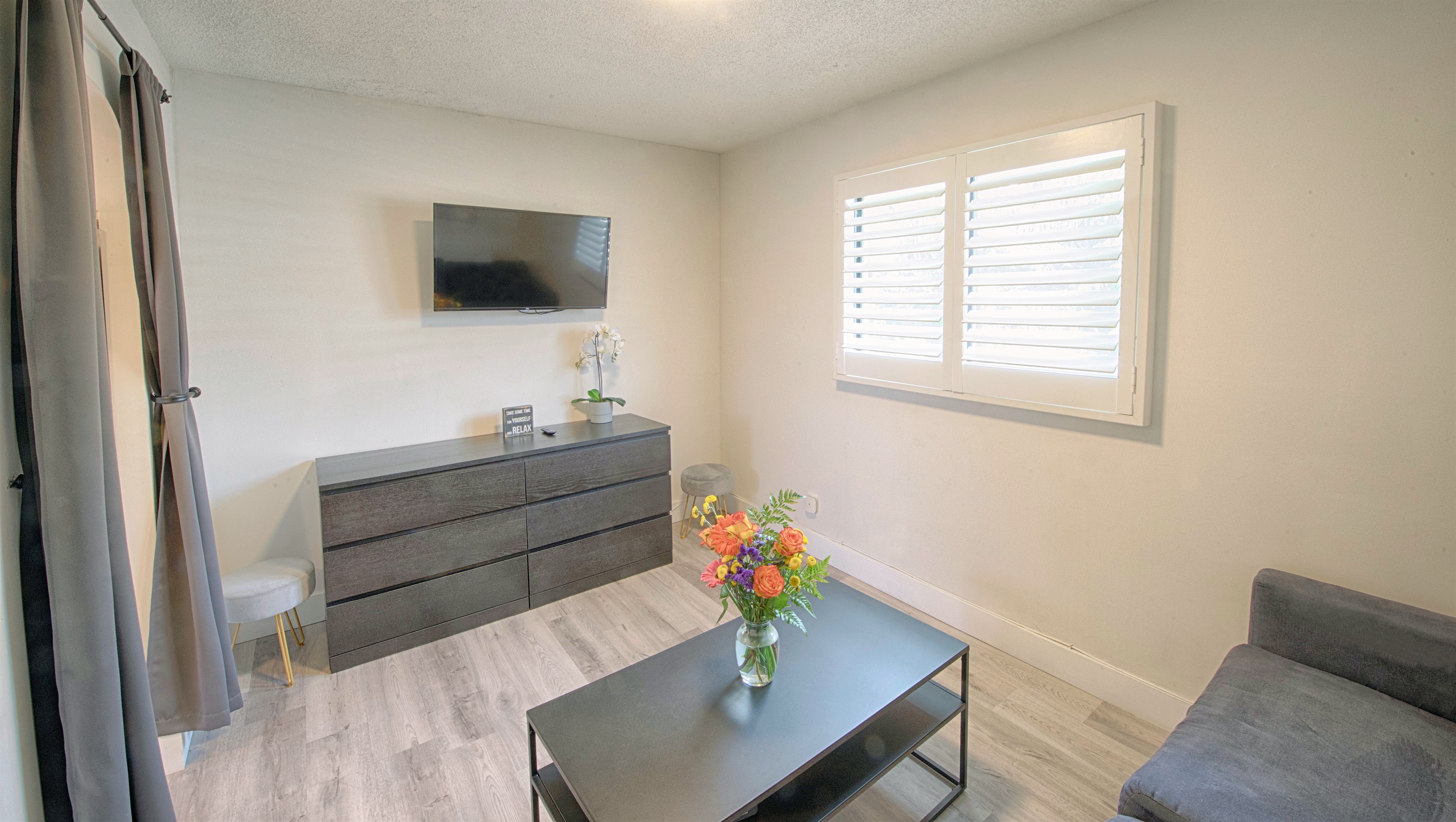 Featuring smart TV and dresser for additional clothing storage.