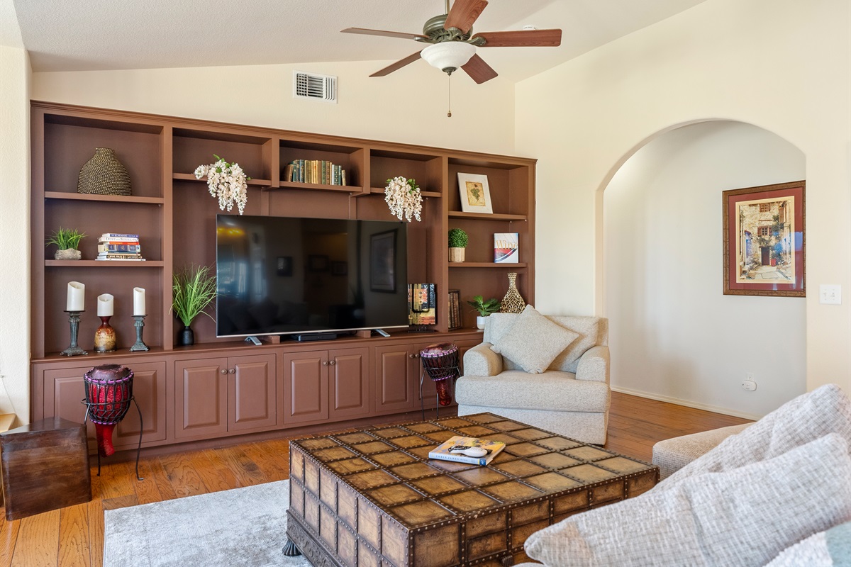 Relax in the spacious living room complete with cozy pellet stove and smart TV.