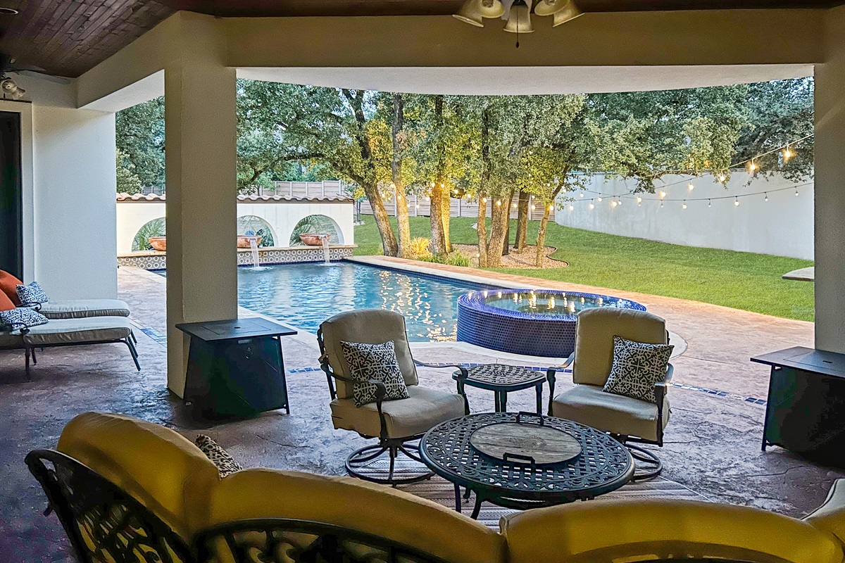 "Poolside bliss! 🏊‍♂️ Escape the heat in our lovely covered patio, where comfort meets stunning views. Perfect for morning coffee or evening cocktails!"