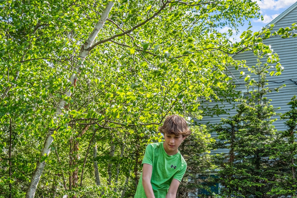 Kids enjoying the putting green and sand trap