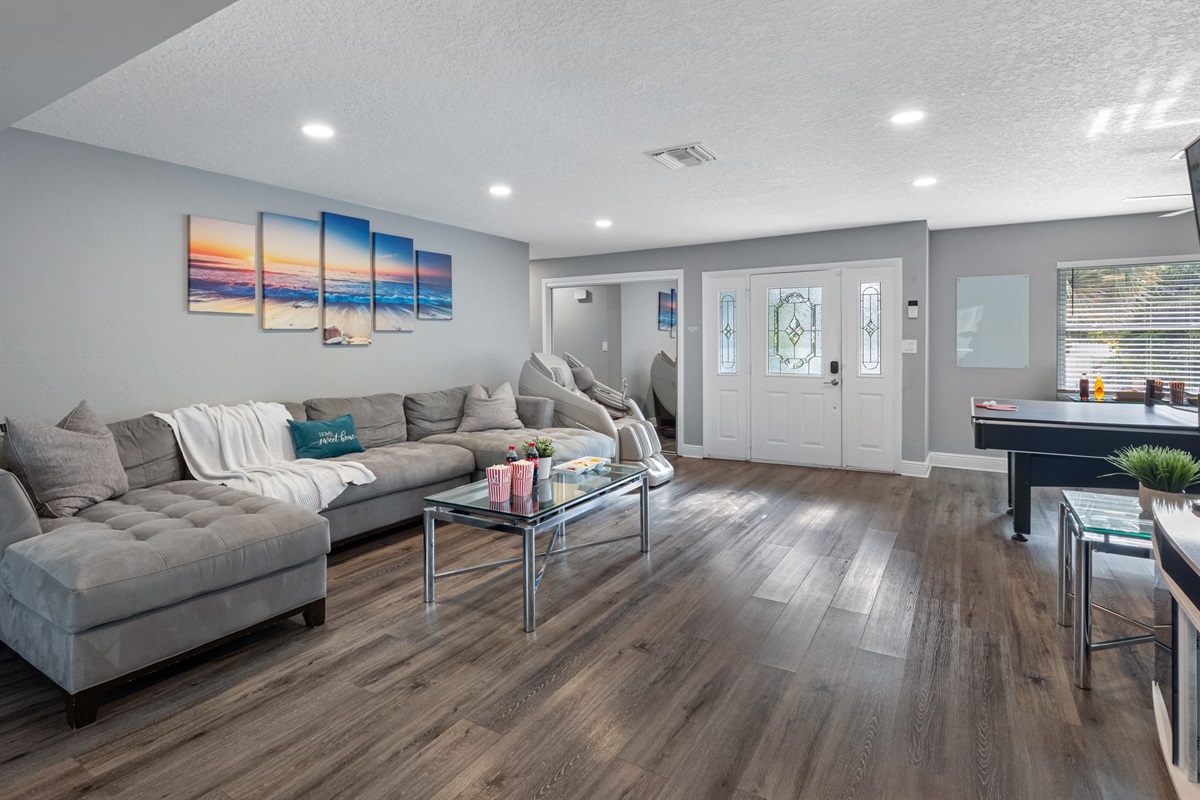 A roomy and inviting sectional provides plenty of seating for family movie nights, board games, or casual hangouts.