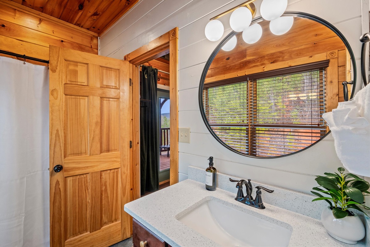 Bedroom 1 has a private bathroom with a shower/tub