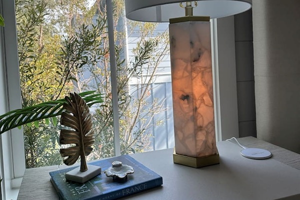 Spacious 2nd level king bedroom suite with full ensuite bathroom, tiled shower, dual vanity sinks, and newly remodeled outdoor shower.