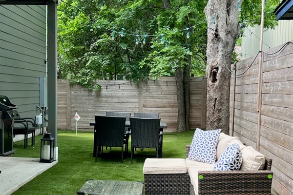 grill, sitting area, and TV in yard and patio