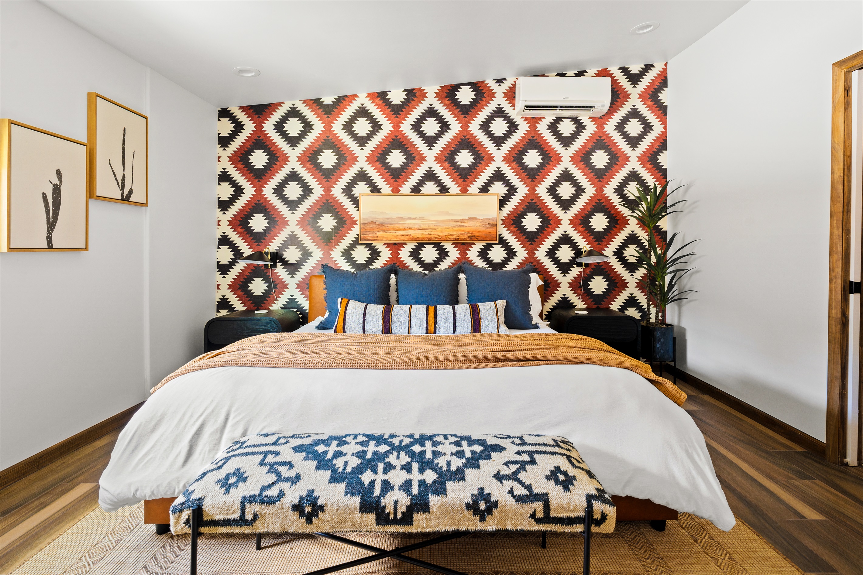 Stunning primary bedroom with a king bed, luxurious bedding, bold patterns, and a relaxing retreat vibe.