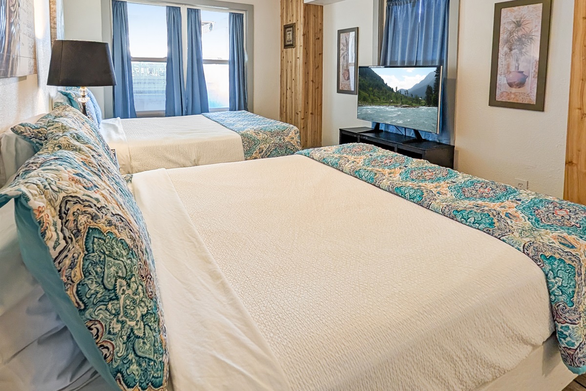 Bedroom #2 has two queens and a smart tv