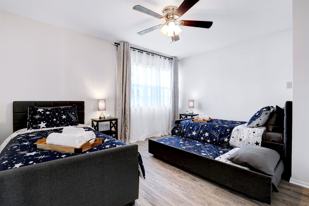 Guest Bedroom #3 with two twin beds with two additional pull out twins.