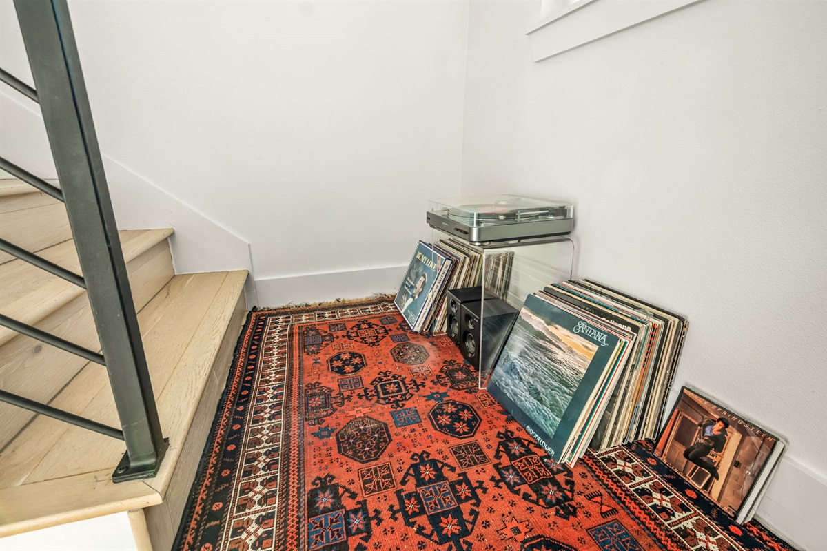 Enjoy a relaxed music corner with a turntable and curated vinyl collection