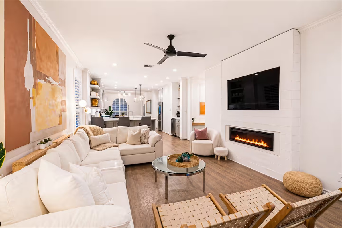 Modern living room with cozy seating and entertainment