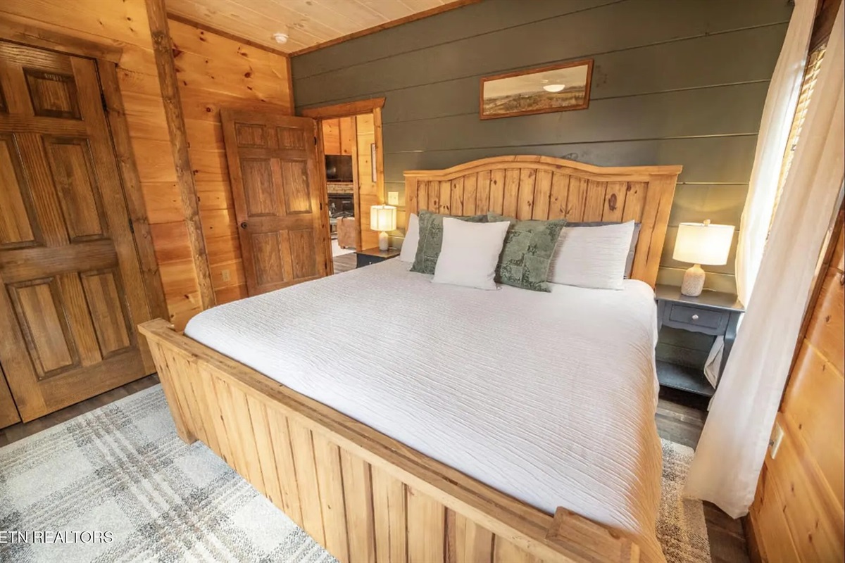 The second king bedroom at Marigold Cabin provides hotel-quality comfort in a cozy cabin setting, giving additional guests their own private retreat in Pigeon Forge, TN. With two king bedrooms and a bunk room, Marigold accommodates couples, families.