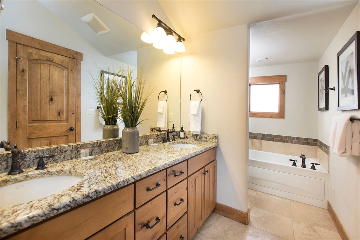 Master bath with dual vanity sink, tub and walk in shower