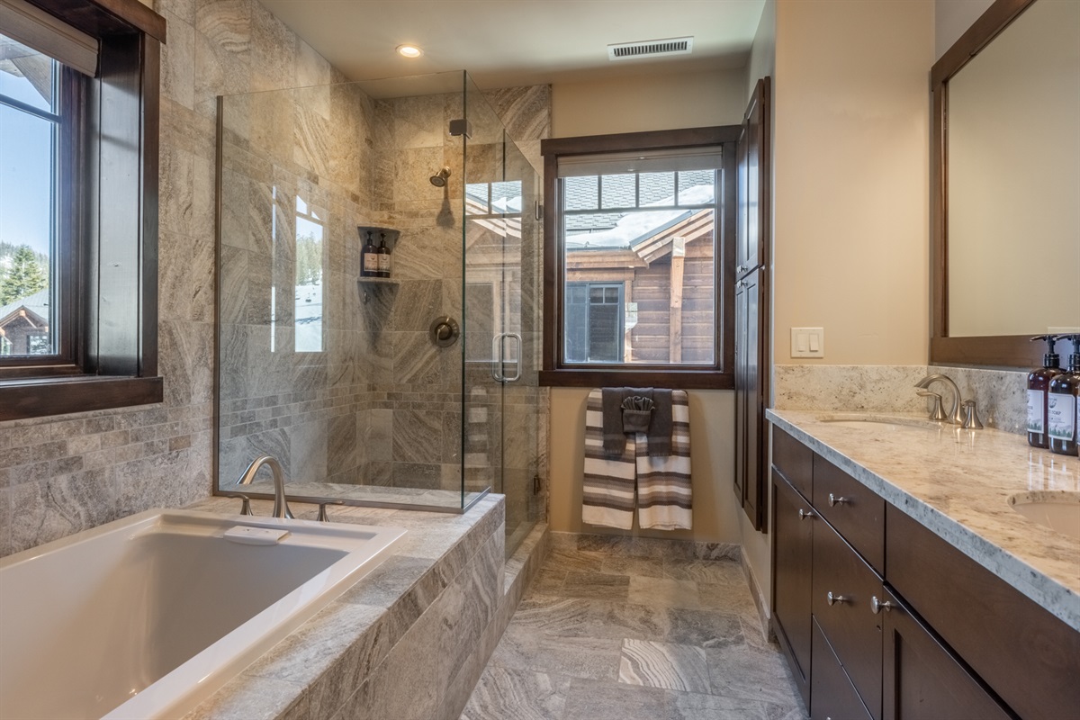 Step into your own spa retreat with a deep soaking tub, walk-in shower, and private toilet room—designed for unwinding in total comfort and style.