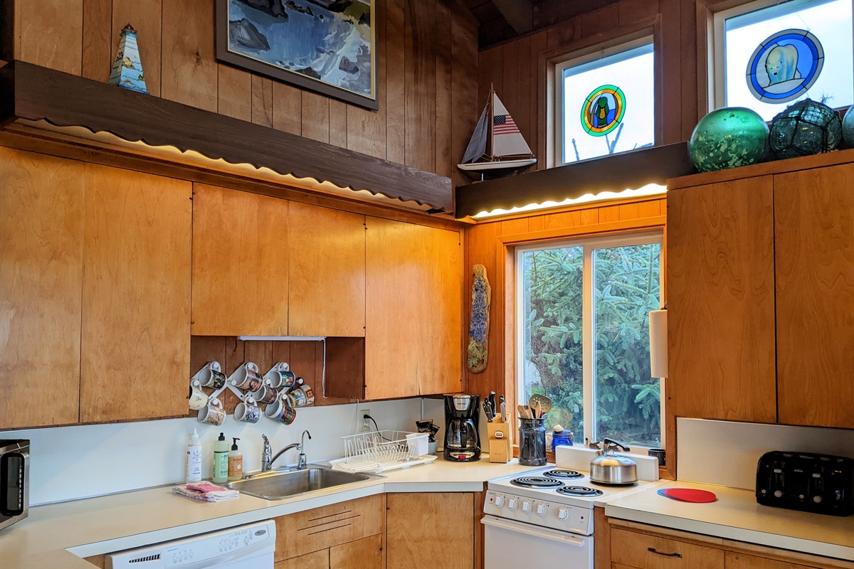 kitchen with small range full size dishwasher