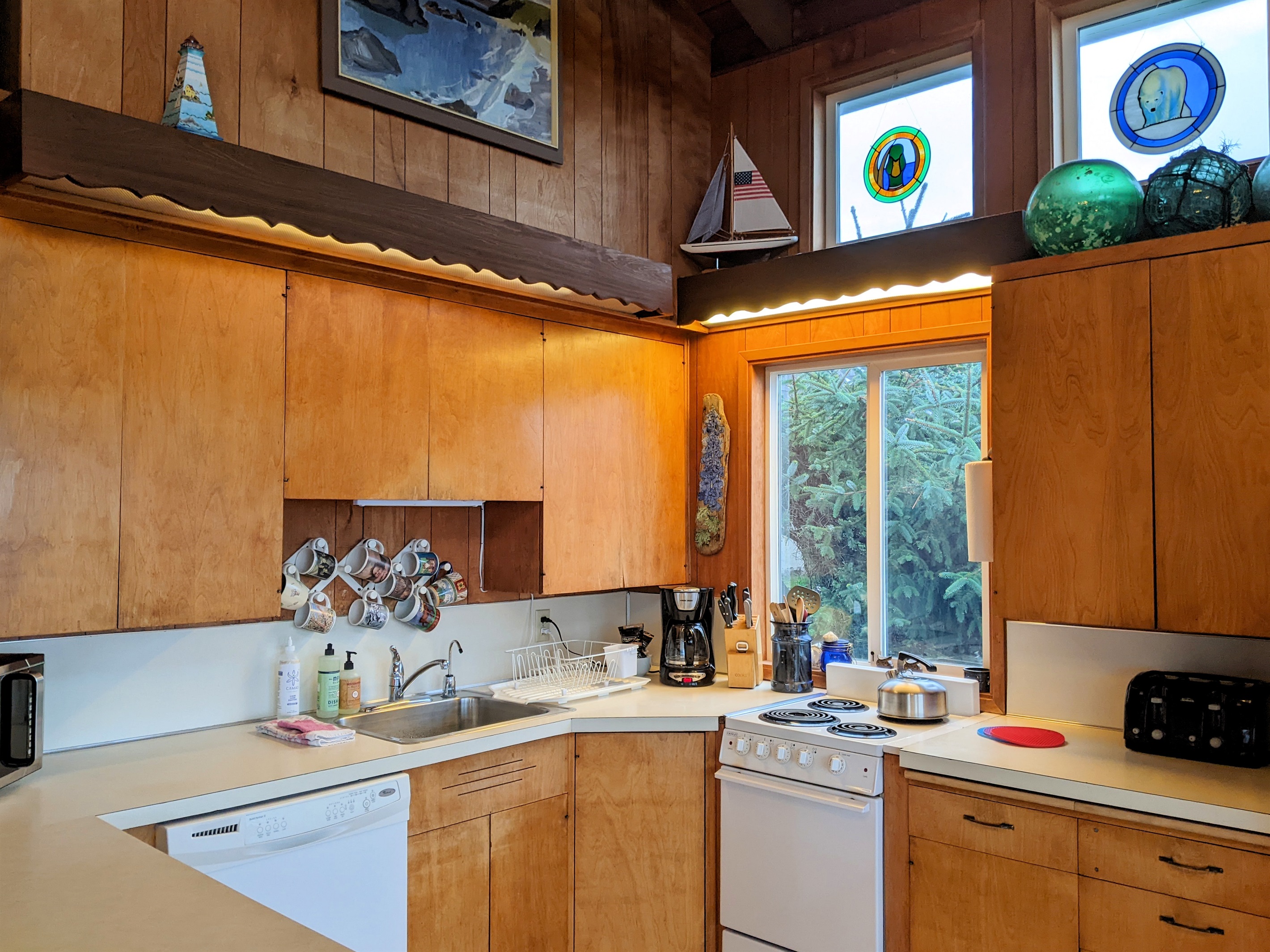 kitchen with small range full size dishwasher