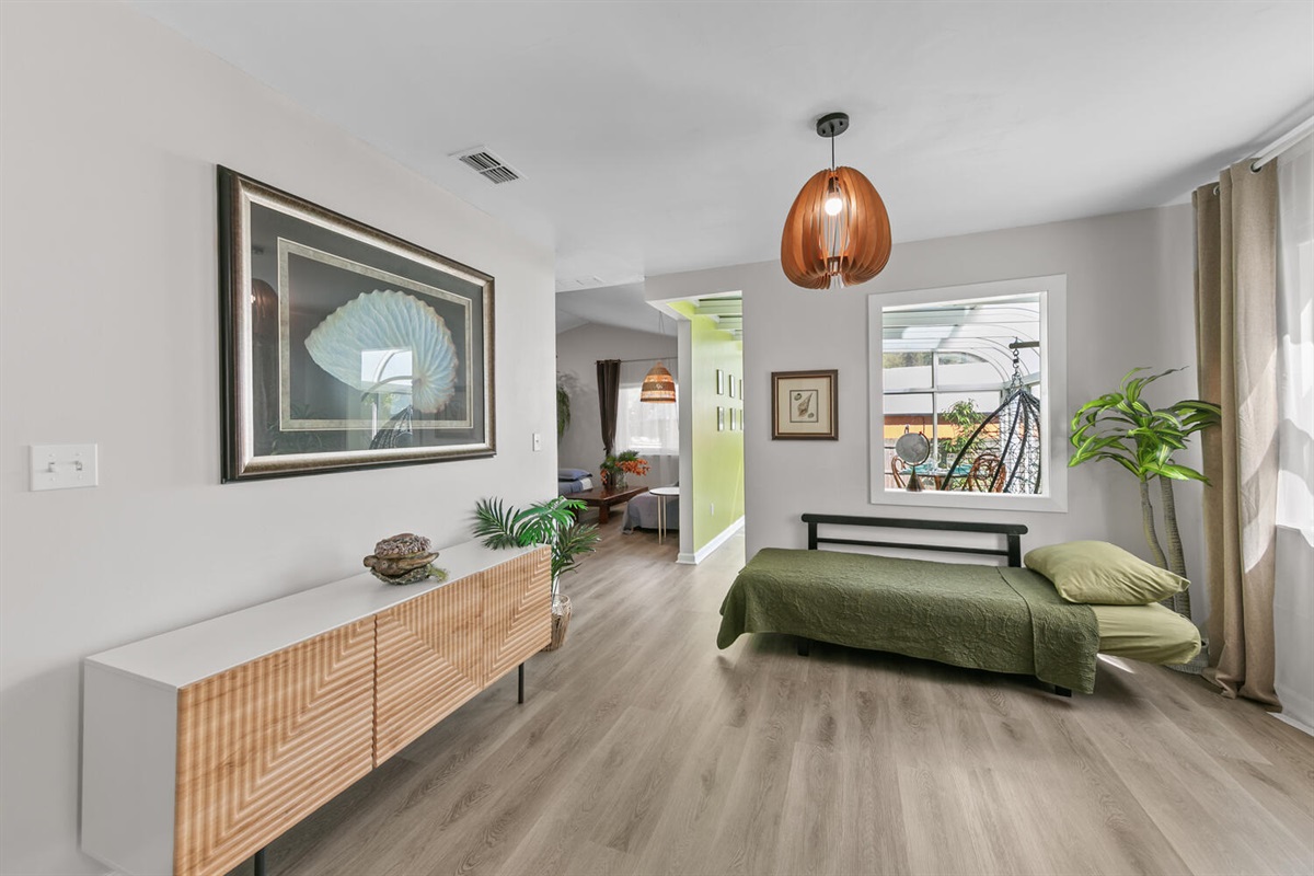 entry showing couch conversion to bed