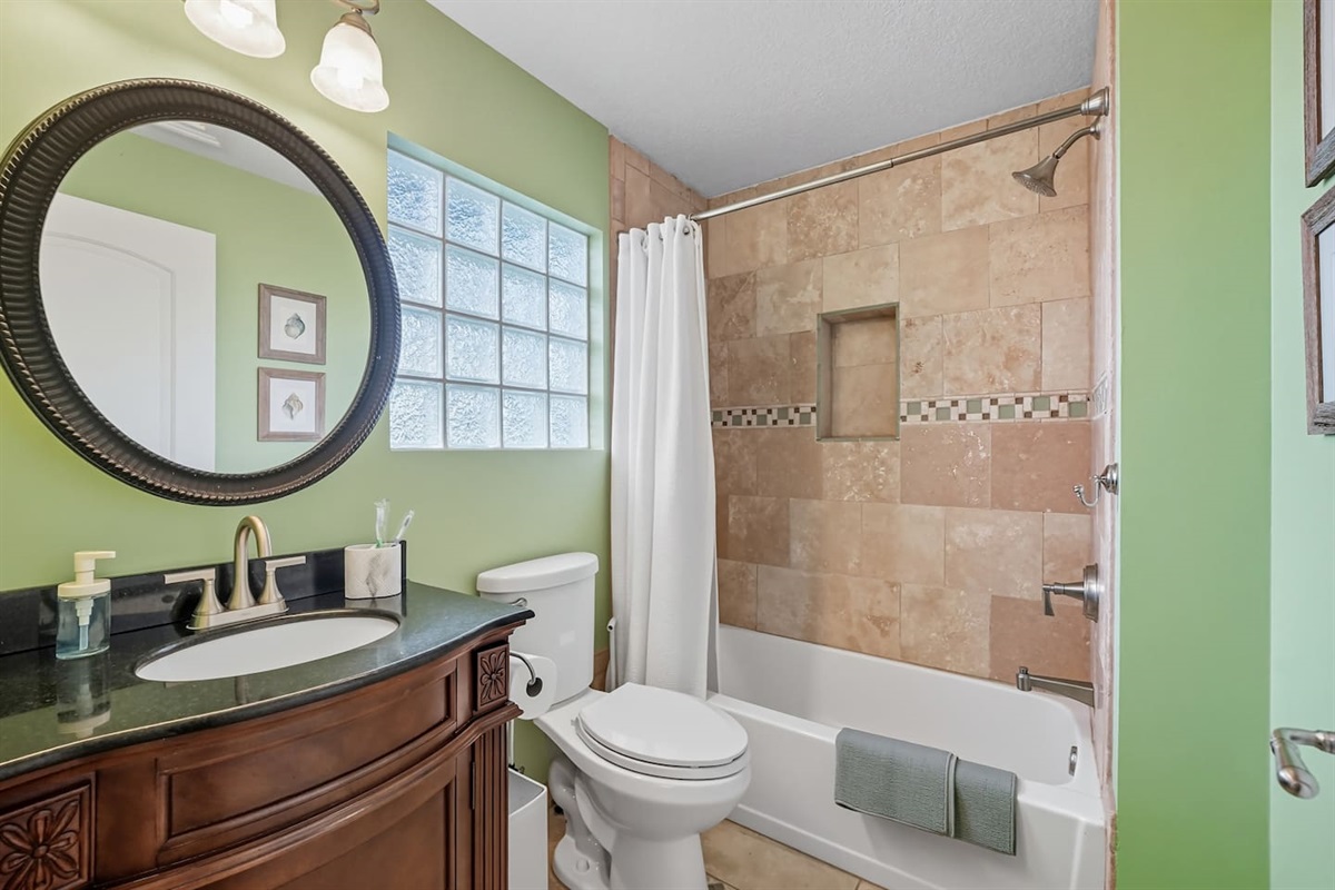 private upstairs ensuite guest bathroom with shower and tub