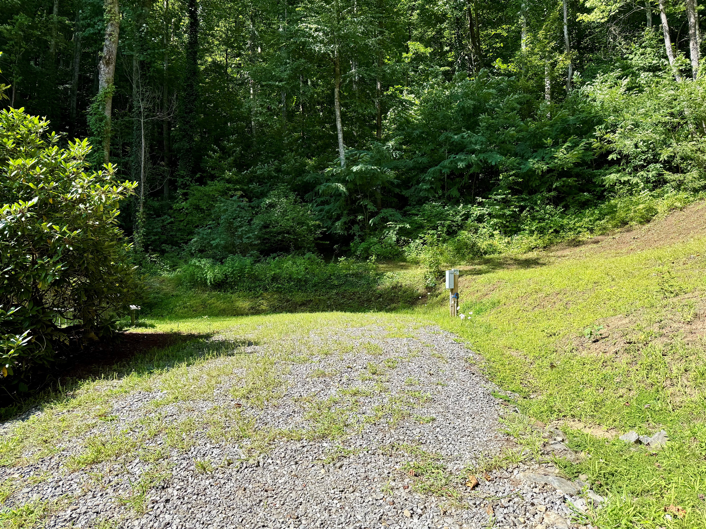 All set for your next getaway — full hookups, picnic table, and peaceful mountain vibes at Site 3.