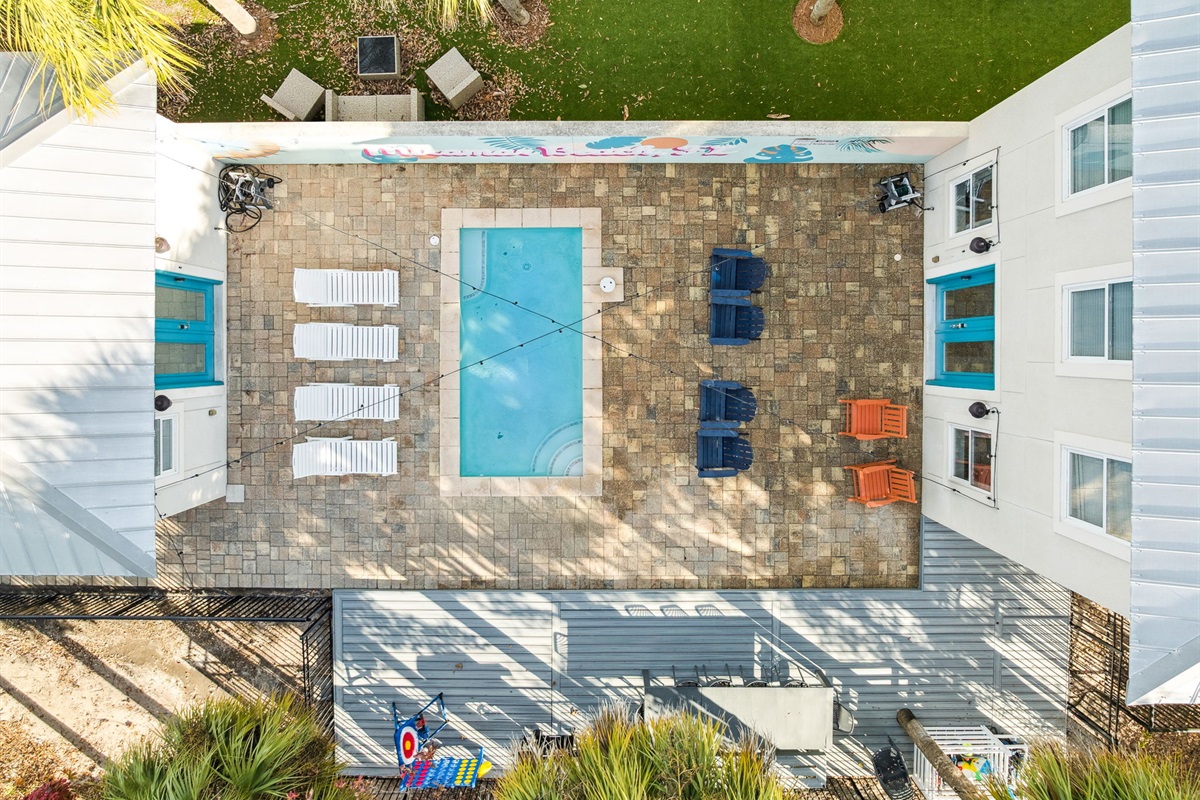 Poolside paradise and outdoor comfort, beautifully captured from above.