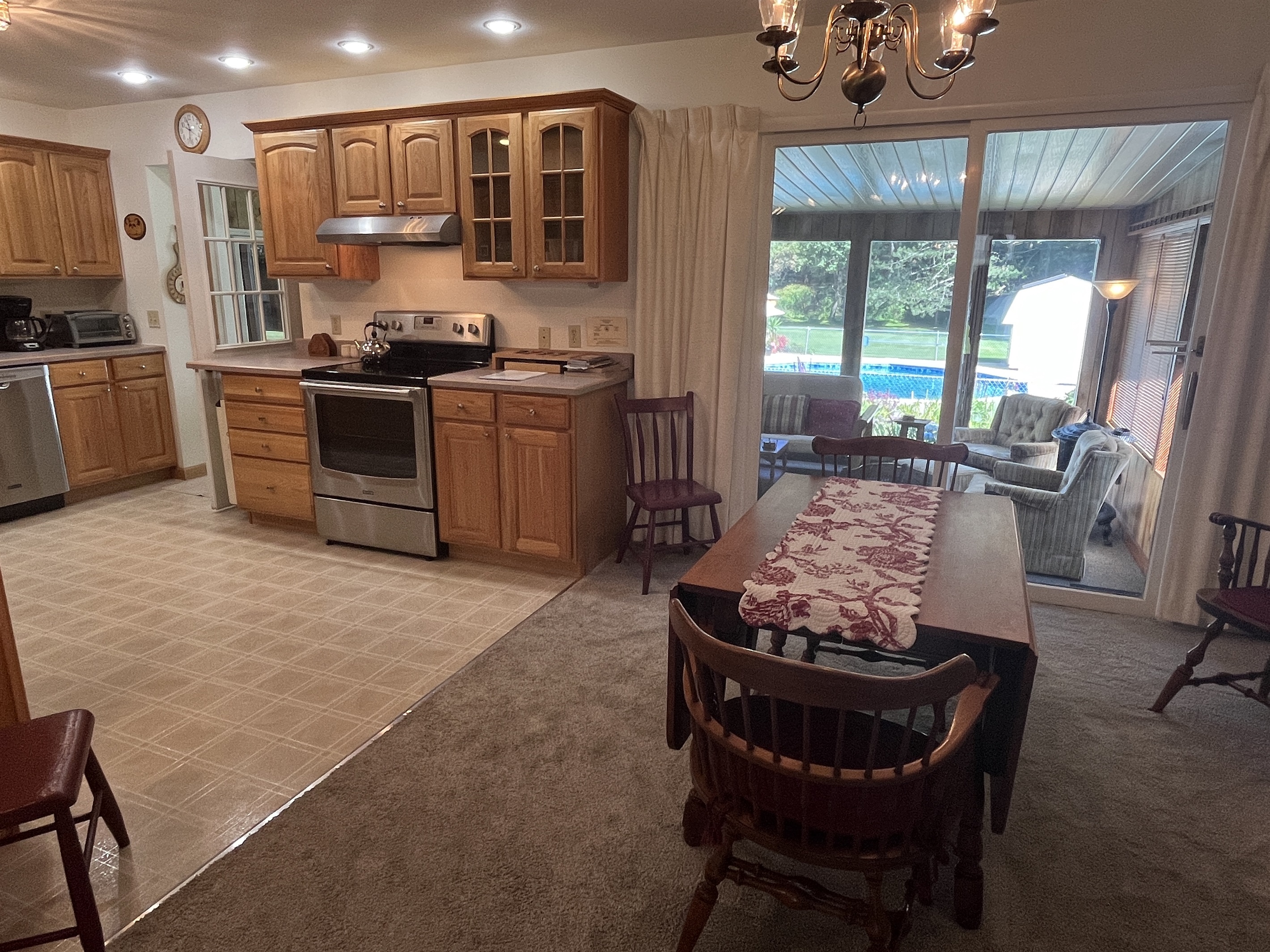 Eat-in kitchen with slider to sunroom
