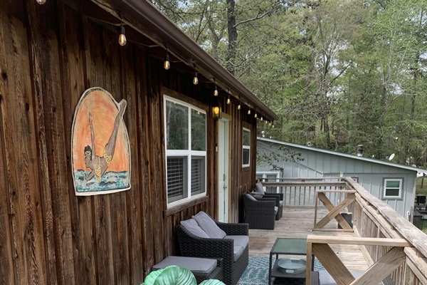 Upstairs deck with table for 6 and comfortable seating.