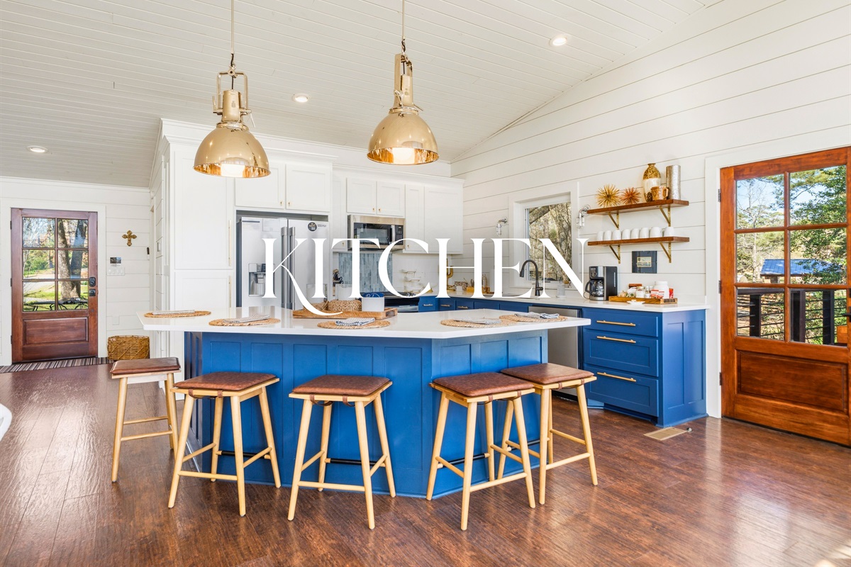 Step into the kitchen where vibrant cabinetry and a spacious layout make cooking both fun and convenient.