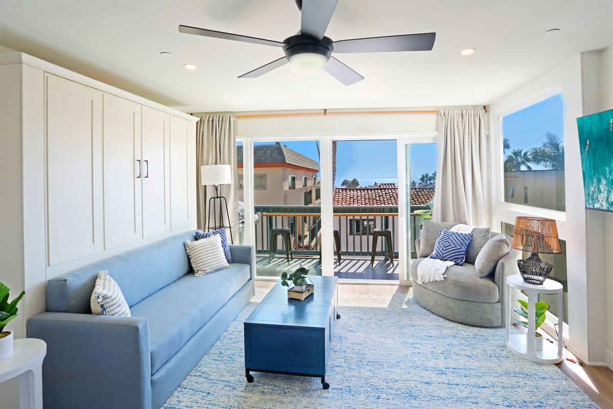 Casa Capistrano Condo 4's living room is full of natural light and extends out onto your own private balcony with an ocean view :)