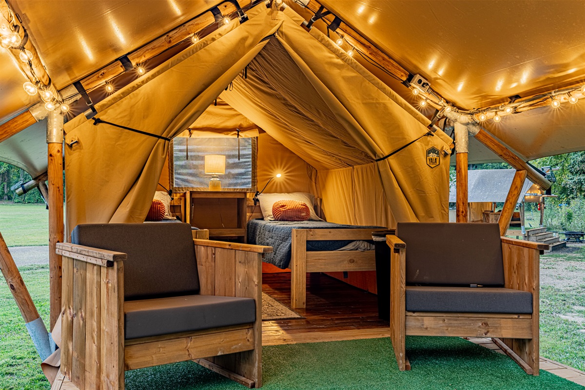 A warm welcome, day or night. The light spilling out from the tent entrance invites you in for a restful night after a day of adventure.