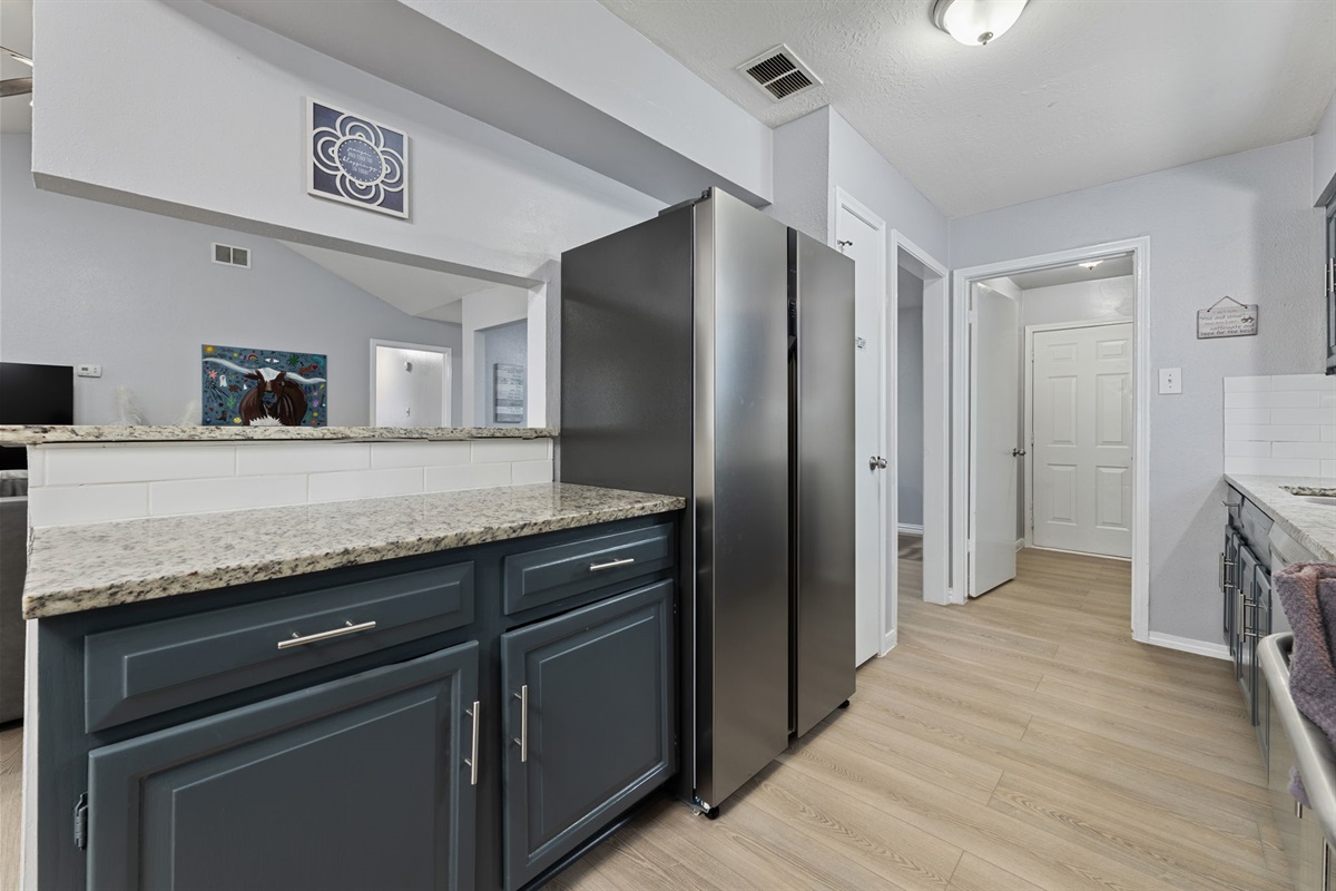 Stainless steel appliances including oven, microwave, and dishwasher
