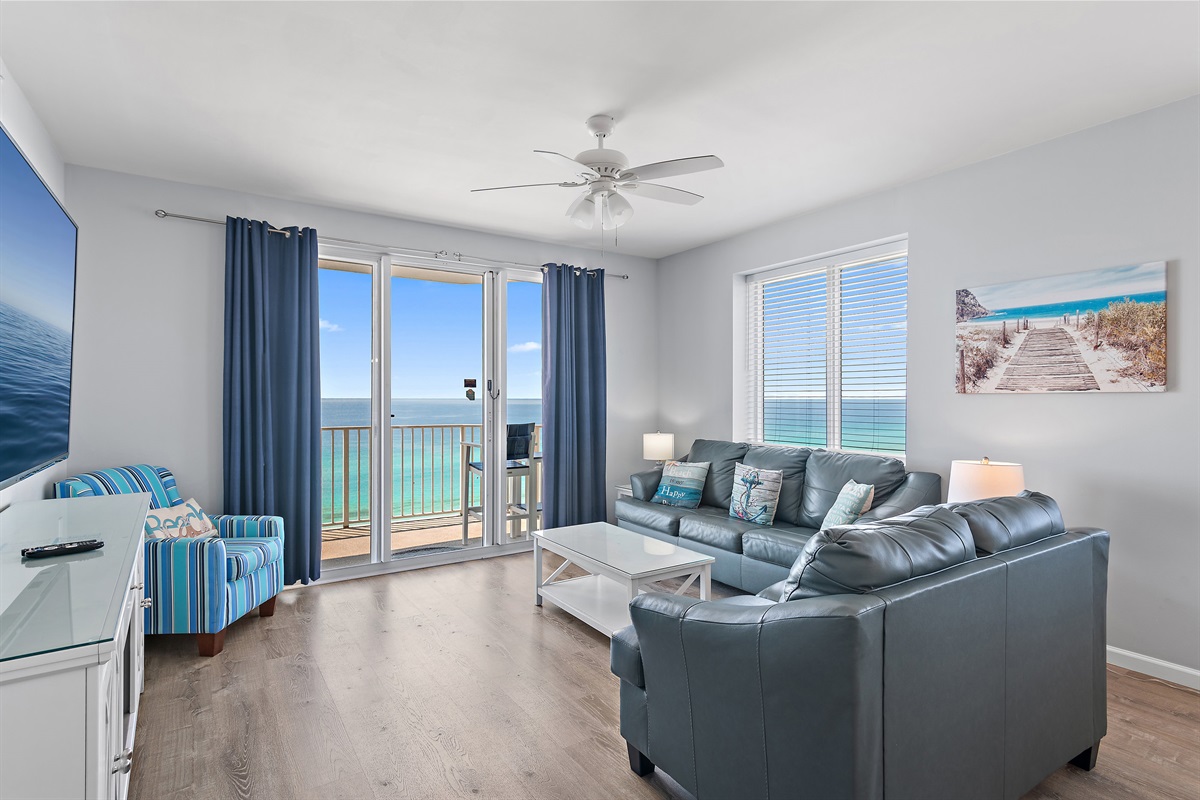Living Room features Gulf Views from many angles, NEW Leather Sleeper Sofa and Love Seat, and a 65" Smart TV!